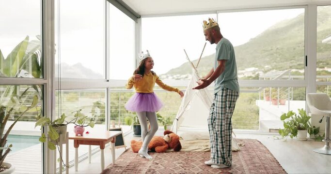 Fantasy, dance and a dad with his daughter for fun while playing together as king and princess in their home. Love, family or kids with a father and happy young female child bonding in a house