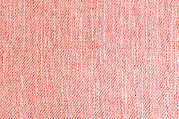 Fototapeta premium Jacquard woven upholstery, red coarse fabric texture. Textile background, furniture textile material, wallpaper, backdrop. Cloth structure close up.