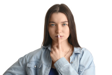Young woman in shirt showing silence gesture on white background, closeup