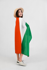 Little girl with flag of Italy on light background