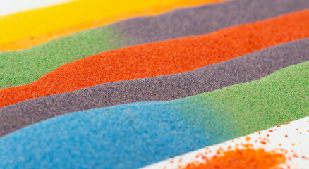 rainbow colored sand stripes on white background in high resolution