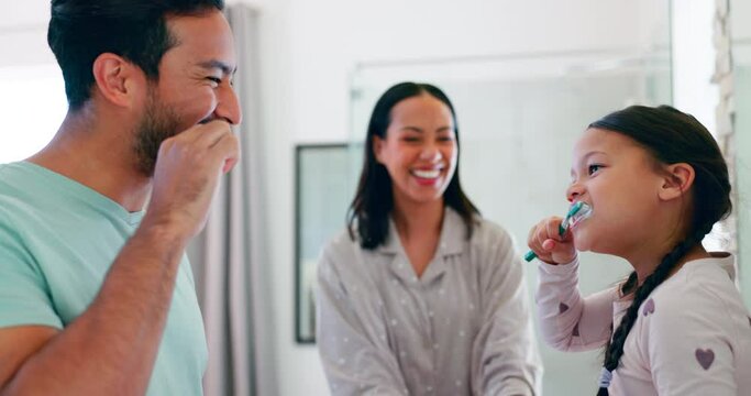 Happy, parents and teaching with kid for brushing teeth in bathroom for morning routine with high five. Child, learn and family with toothbrush for oral care or fresh breath for motivation in home.