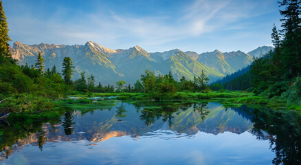 panorama of a beautiful landscape with a lake and mountains