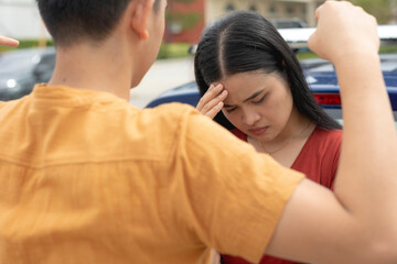 A woman looks down ashamed after being berated by her toxic boyfriend. A controlling and...