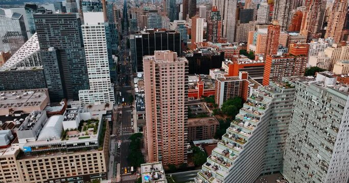 Beautiful and varied architecture of New York at daytime. Drone flying above the unusually designed buildings of metropolis.