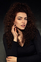 Portrait photos of a young, beautiful, white-skinned and red-haired girl, headshot. Portrait, headshot photos of a young and talented actress candidate, taken on a black background