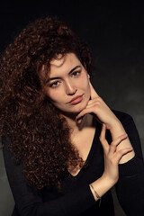 Portrait photos of a young, beautiful, white-skinned and red-haired girl, headshot. Portrait, headshot photos of a young and talented actress candidate, taken on a black background