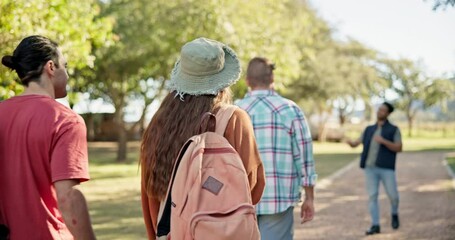 Back, walking and student friends on campus for a university tour of the college grounds together. School, education and orientation with a group of academic learners outdoor for higher learning