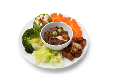 Set of chili paste in the boat with vegetables in a white plate
