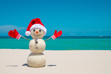 Snowman. Snowman with red Santa Claus hat and mittens. Merry Christmas and Happy New Year. Sandy...