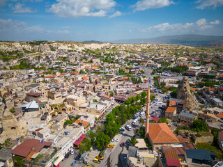 Fototapeta premium Goreme Town Center historic building with fairy chimney landscape near Goreme National Park in Cappadocia, Anatolia, Nevsehir Province, Turkey. Goreme is a UNESCO World Heritage Site since 1985. 