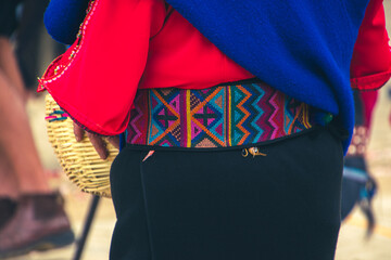 Embroidered details of the clothing of the indigenous woman Saraguro, Ecuador.