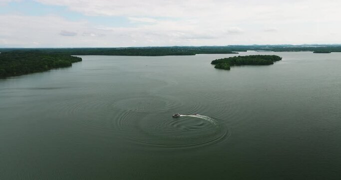 Leisure boats motoring in circle in Percy Priest lake reservoir, aerial view