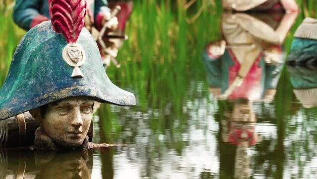 Statue of Napoleon in deep water decaying, close up view