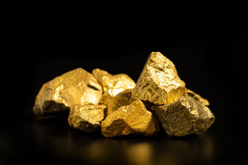 The pure gold ore found in the mine on black background