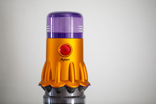 BANGKOK,THAILAND ; MAY 1 2023:A closed up view of Dyson V12 in gold colour vacuum hang at a dock