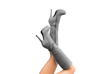 Sexy woman legs up in gray suede knee with rhinestones high stiletto high heels platform boots isolated. Legs up and bent in knees