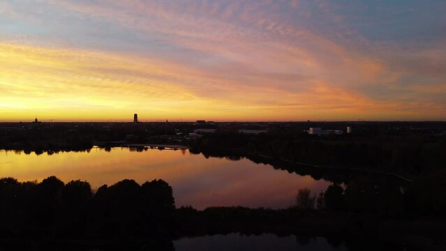 Mechels Broek silhouetted horizon at sunset with cinematic light.