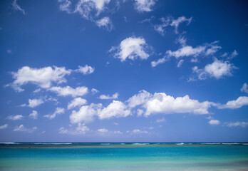Fototapeta na wymiar Blue Sky and Cumulus Clouds Above the Ocean in Waikiki, Hawaii.
