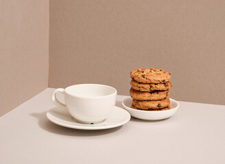 Morning healthy breakfast. A cup of coffee and a cookie with chocolate chunks.