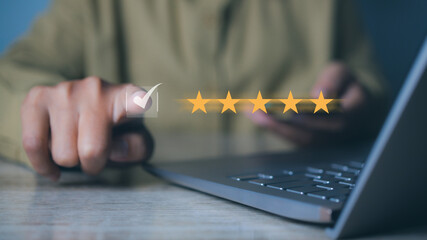 Businessman touching giving high score for feedback review satisfaction service. Customer satisfaction experience with five star icon and excellent for feedback review satisfaction service.