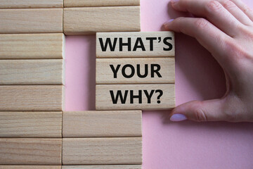 What is Your Why symbol. Concept words What is Your Why on wooden blocks. Businessman hand. Beautiful pink background. Business and What is Your Why concept. Copy space.