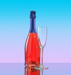 A bottle of sparkling wine and a glass on a pink blue background. Luxury alcohol vacation.
