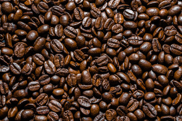 Brown coffee beans background. Coffee beans, top view.