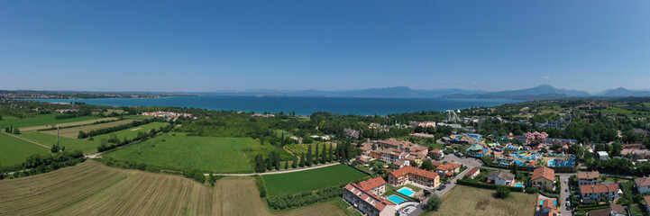 Fototapeta na wymiar Aerial panorama of the popular Amusement Park on Lake Garda aerial view. Attractions in Italy. Amusement park, attractions on Lake Garda in Italy, aerial view.