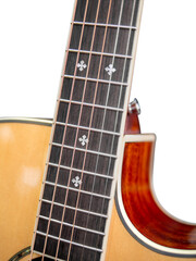 The neck of a six-string acoustic guitar on a dark background . guitar neck on a white background. Guitar fingerboard. selective focus.