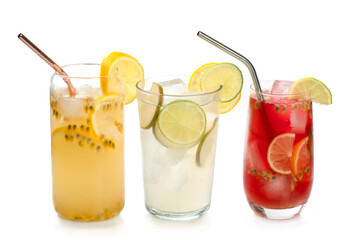 Three cold drinks with lemon, limes and passion fruit 
