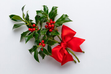 Christmas Holly Leaves and Berries on White background.