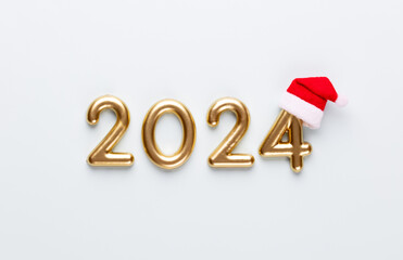 New year 2023 number, golden digits and santa hat over blue background. - 633234537