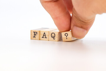FAQ Text in wooden cubes on white background