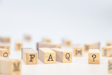 FAQ Text in wooden cubes on white background