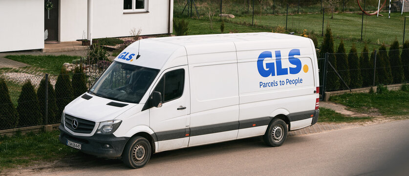 29.04.2023 Poland, Europe. GLS delivery truck. A white van with parcels in the countryside. Logo of the GLS at the truck. GLS is British logistic company