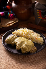Pipian, also known as mole verde, food from mexico and other latin american countries, chicken meat bathed in mole sauce made with pumpkin seeds, dried chili peppers and several other ingredients.