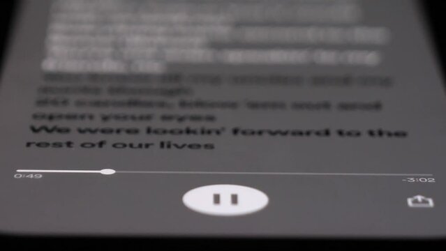 Listening to music on Spotify app, close up view