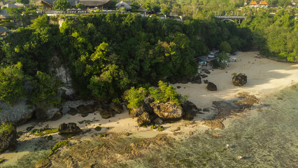Beach With Rock And Cliff Drone Shot