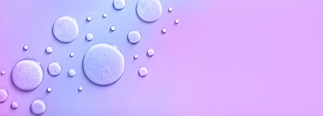 round drops of transparent gel serum with place for text