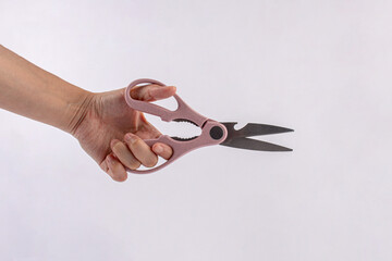 Office stationery scissors cutting in hand on white background