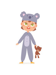 Cute little child in koala suit, funny girl in kigurumi overalls standing on pajama party