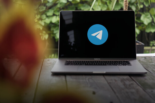 Telegram logo, a free instant messaging service founded by brothers Nikolai and Pavel Durov (Russian entrepreneurs), displayed on a MacBook Pro screen