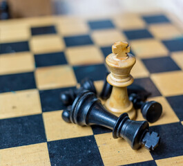 black and wooden chess on a wooden plate