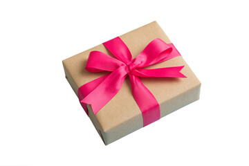 Wrapped christmas or other holiday handmade present in craft paper with colored ribbon. Present box, decoration of gift on table, top view with copy space