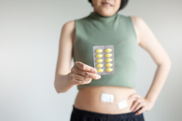 Women holding a painkiller pack for relieve inflammation after endoscopic surgery