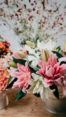 Close up of flowers in different vase on a table