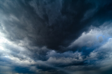 storm sky, dark dramatic clouds during thunderstorm, rain and wind, extreme weather, abstract...