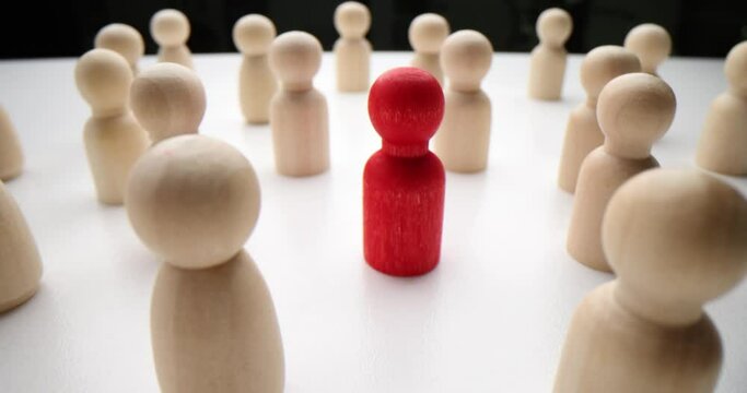 Red man stands out from crowd. Minority opinion different views and distinctive concept