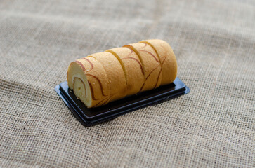Mini vanilla roll cake, swiss roll cake or sponge roll with Vanilla flavor for a coffee break. Thai...